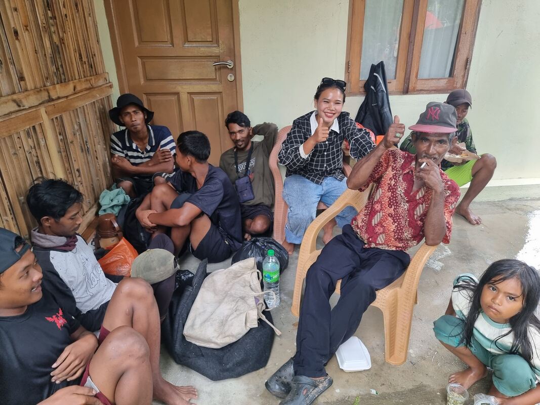 A family group sitting together indoors