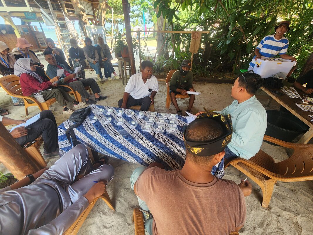 Two men relaxing in the shade of a beachside shelter