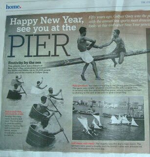 Newspaper clipping headlined 'Happy New Year, See You at the Pier,' about a seaside New Year model-boat racing tradition